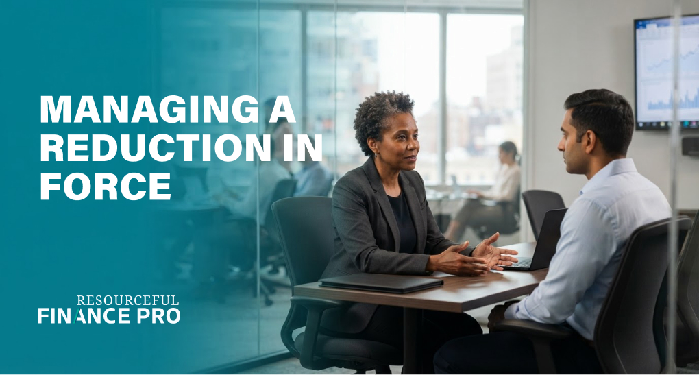 Finance leader leaning in during a private one-on-one meeting with an employee, managing a reduction in force with compassion