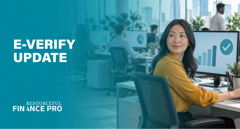HR specialist on an open office floor turns from a screen showing a verification status check, E-Verify status change report